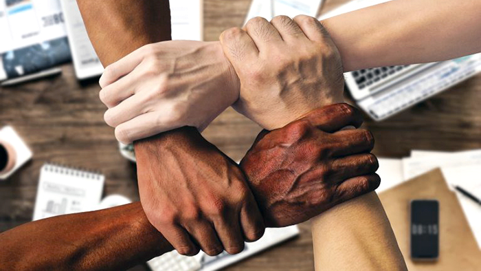 An image of hands holding together showing diversity