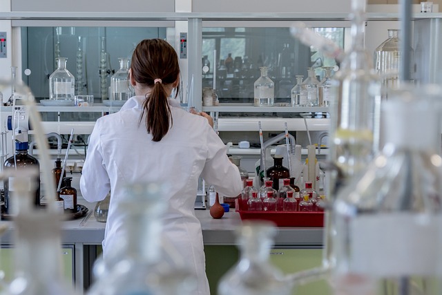 Image of a woman facing away from view in a laboratory