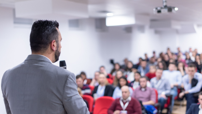 Lecturer stood in front of students