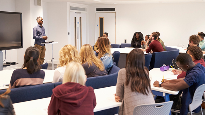 A classroom of students watching a lecturer