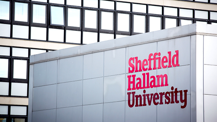 A view of Owen Building with the Sheffield Hallam logo looking vibrant. 