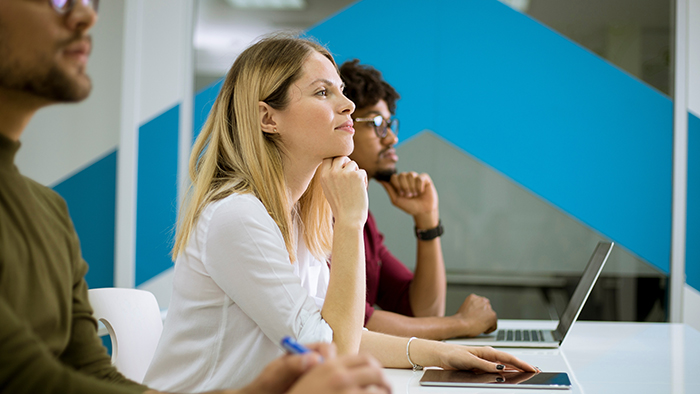 Young adults looking attentive in a classroom